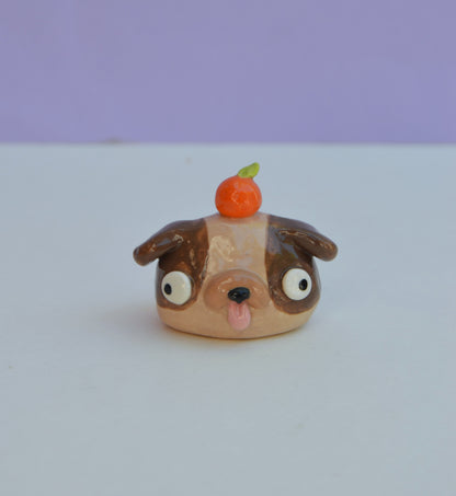 Mini Dog Bust With Orange On Their Head