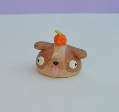 Mini Dog Bust With Orange On Their Head