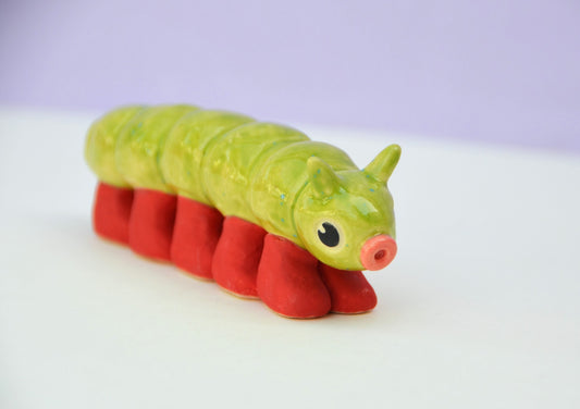 Caterpillar Sculpture With Little Red Boots